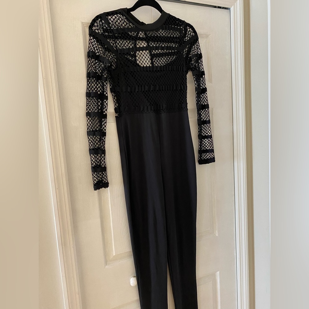 black jumpsuit stretches